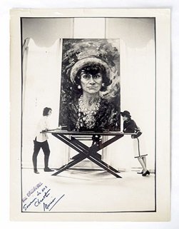 Main Image Courtesy of Jeffie Pike Durham: Marion and Coco pose together with ‘Coco Chanel – Big Head’ painted by Marion, 1967. Photographer unknown.